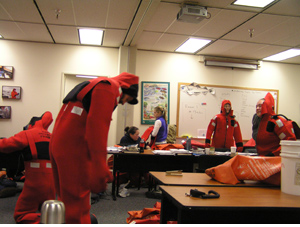 observers practice donning immersion suits